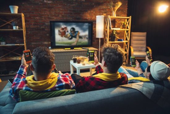 group-friends-watching-tv-sport-match-together-emotional-fans-cheering-favourite-team-watching-exciting-football-concept-friendship-leisure-activity-emotions_155003-38767