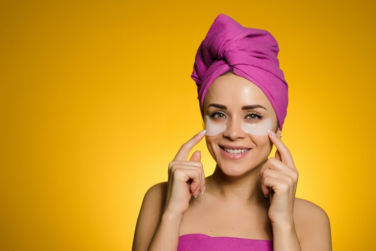 happy-woman-with-towel-her-head-struck-patches-eyes_272330-1524