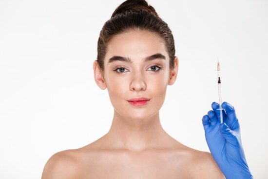 image-pretty-woman-preparing-beauty-injection-made-by-doctor-latex-gloves-holding-syringe-with-hyaluronic-acid_171337-679