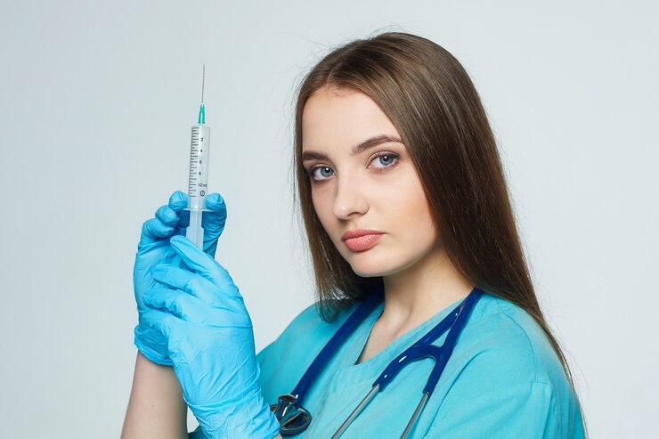 female-doctor-holds-syringe-her-hand_231474-905