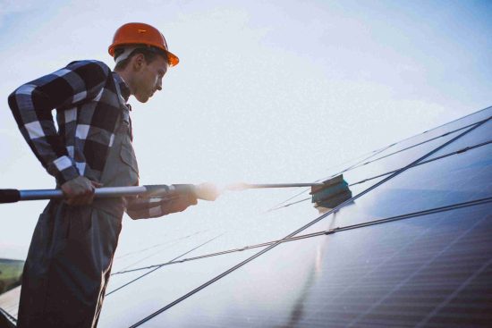 man-worker-firld-by-solar-panels-1