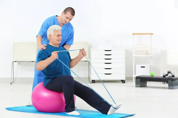 depositphotos_179867508-stock-photo-physiotherapist-working-with-patient-in