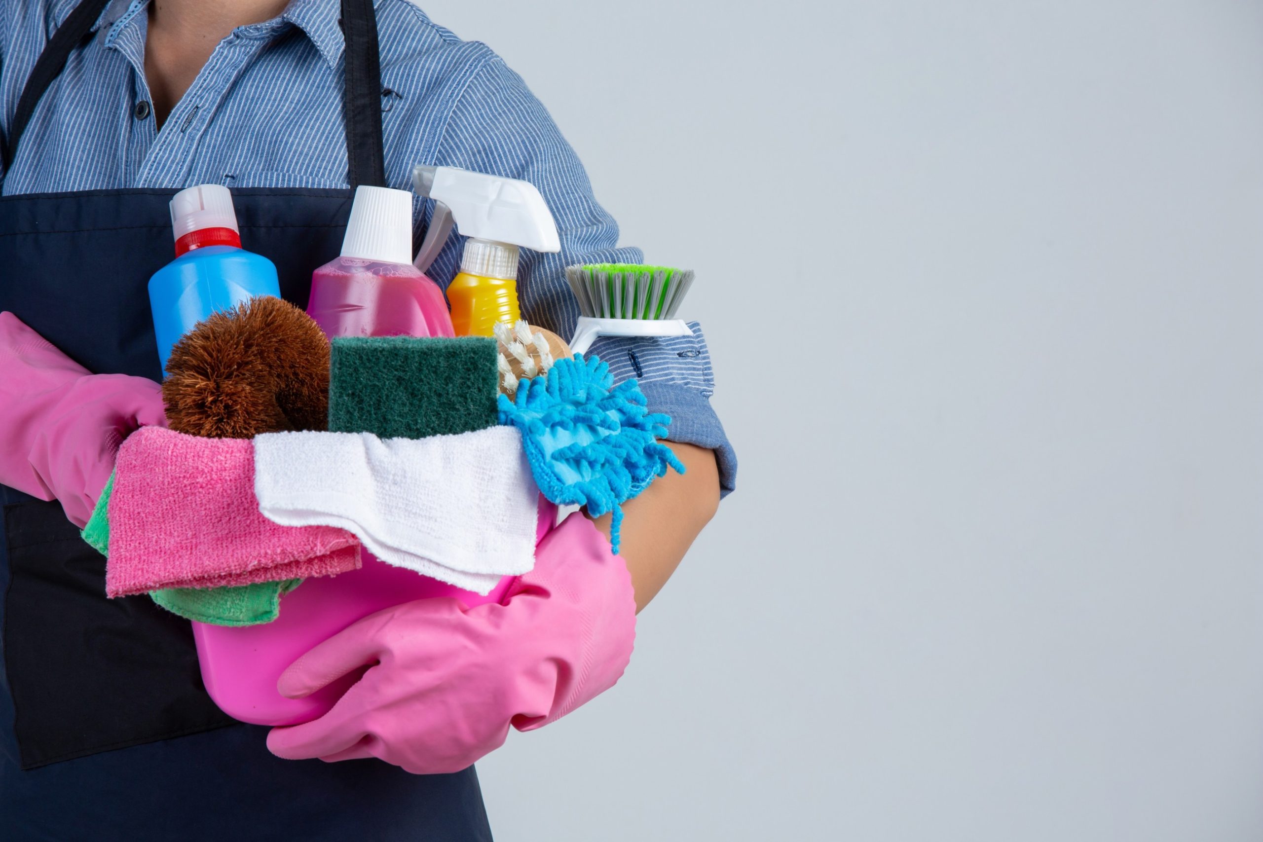 woman-is-holding-cleaning-product-gloves-rags-basin-white-wall (1) (1)