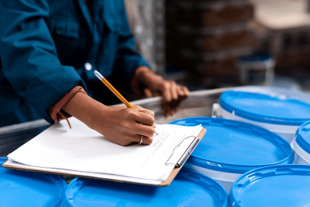 woman-worker-taking-notes-warehouse_23-2149128299